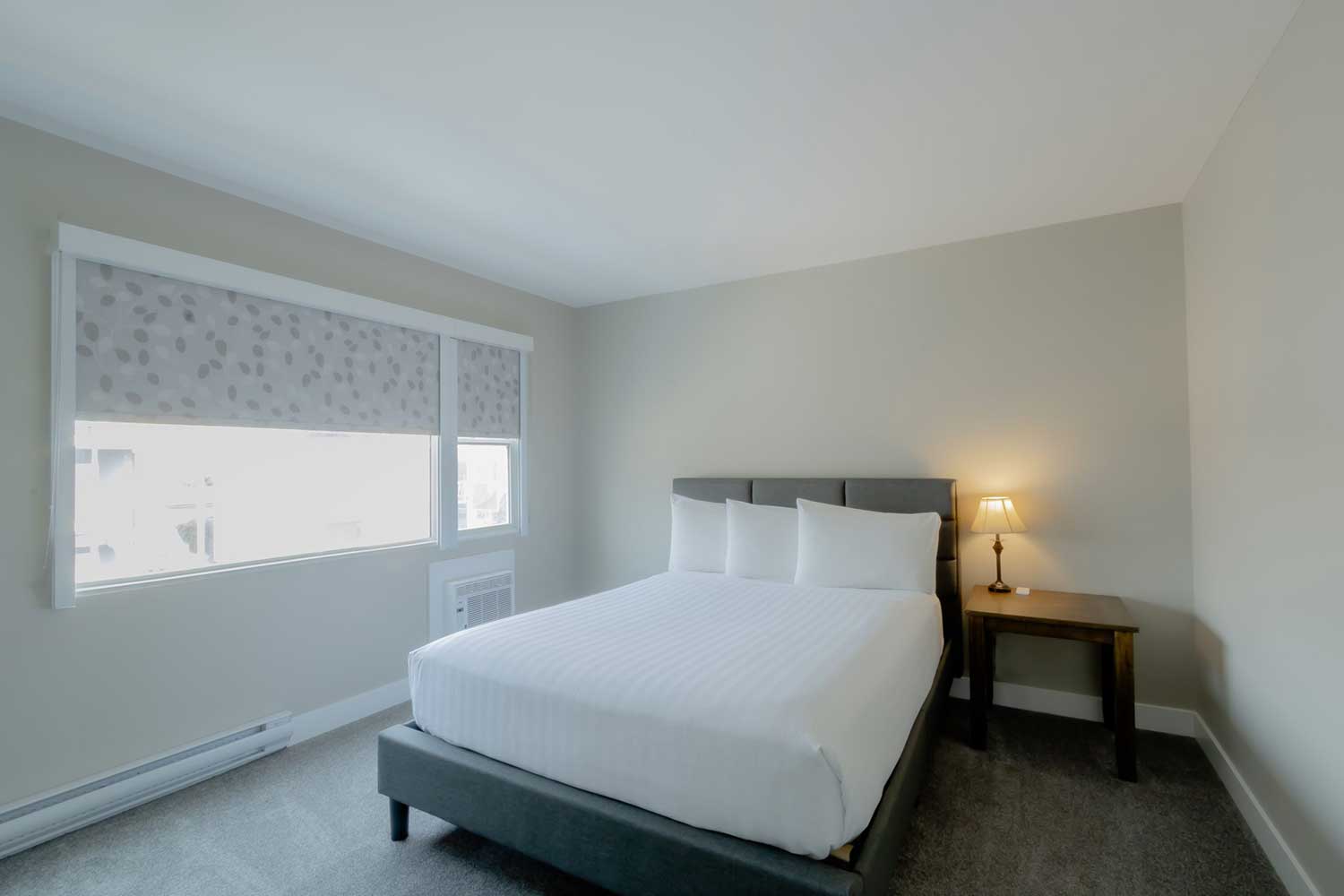A queen bed in the Junior Suite.