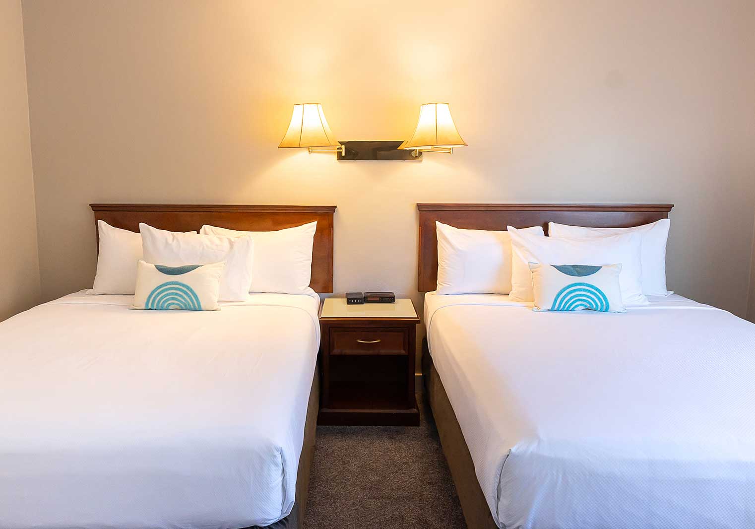 Two beds in a suite at Scott's Inn.