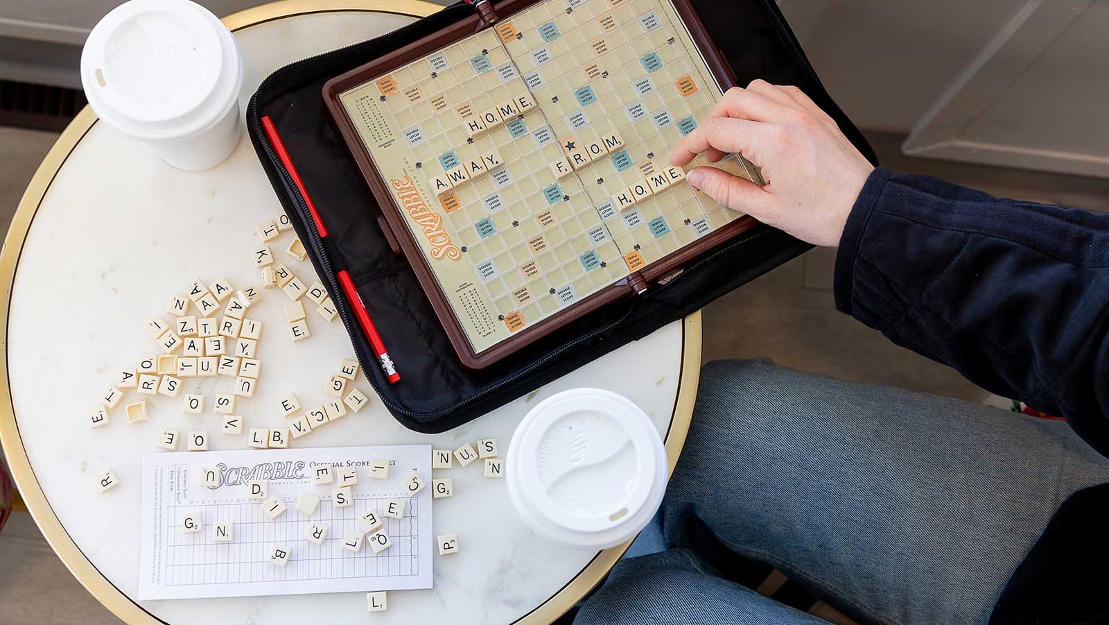 Someone is playing Scrabble! The tiles spell out: Home Away From Home.